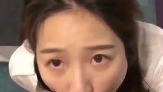 cute Asian gives blowjob in store